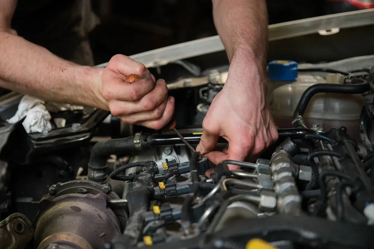 technician-removing-fuel-injectors
