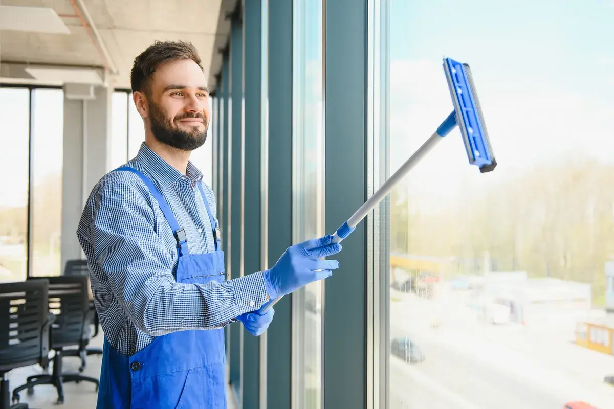 male-worker-washing-window