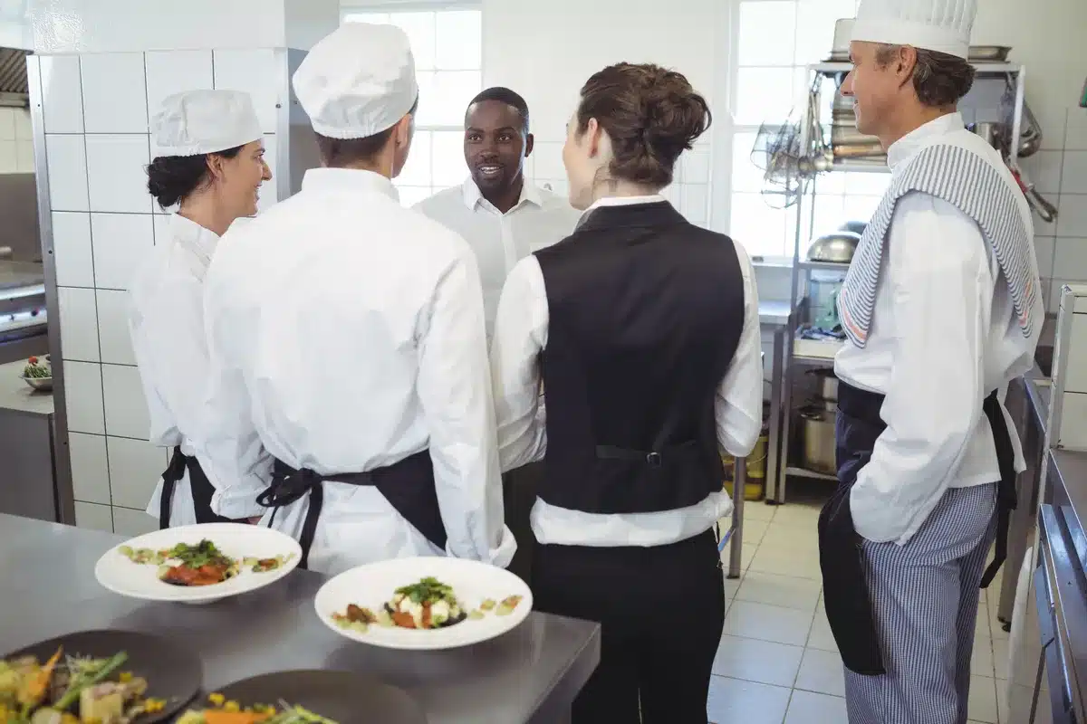 restaurant-manager-briefing-to-his-kitchen-staff